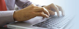 Hands typing on a keyboard